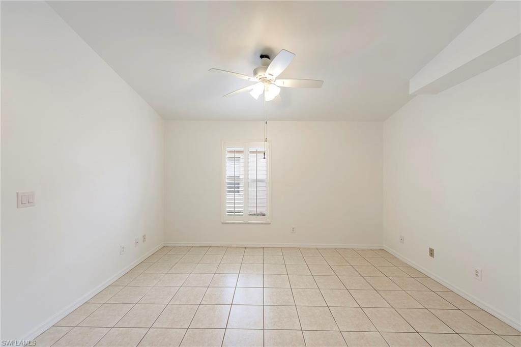21695 Brixham Run Loop Estero, FL 33928 - Photo 15 of 32 an empty room with a ceiling fan and window