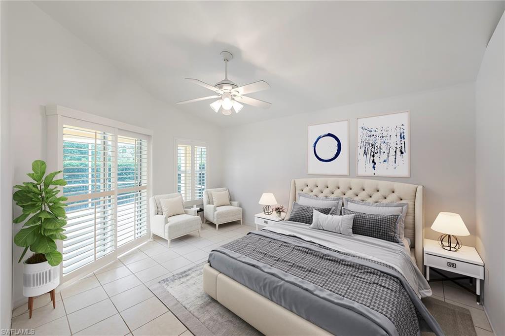 21695 Brixham Run Loop Estero, FL 33928 - Photo 18 of 32 a bedroom with a bed and glass window