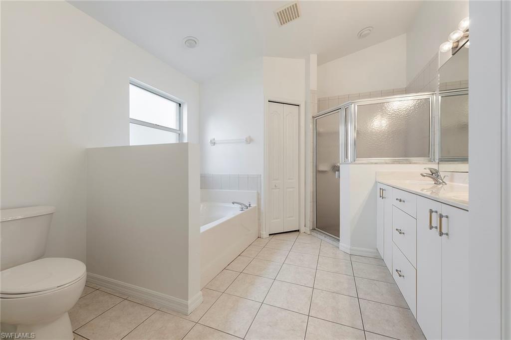 21695 Brixham Run Loop Estero, FL 33928 - Photo 19 of 32 a bathroom with a sink a toilet and shower