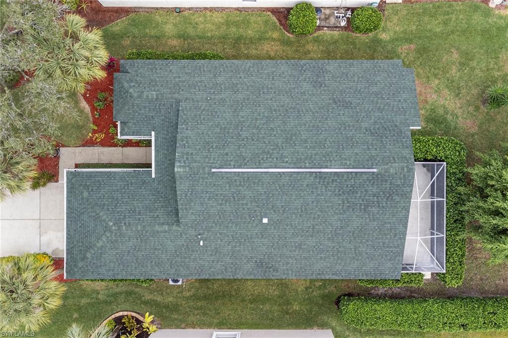 21695 Brixham Run Loop Estero, FL 33928 - Photo 30 of 32 an aerial view of a house with a yard