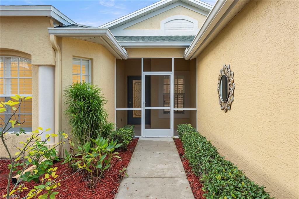 21695 Brixham Run Loop Estero, FL 33928 - Photo 3 of 32 a view of a pathway besides a house