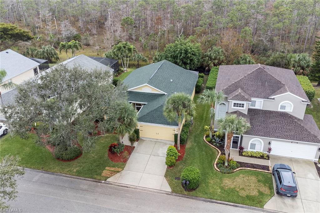 21695 Brixham Run Loop Estero, FL 33928 - Photo 32 of 32 an aerial view of house with yard