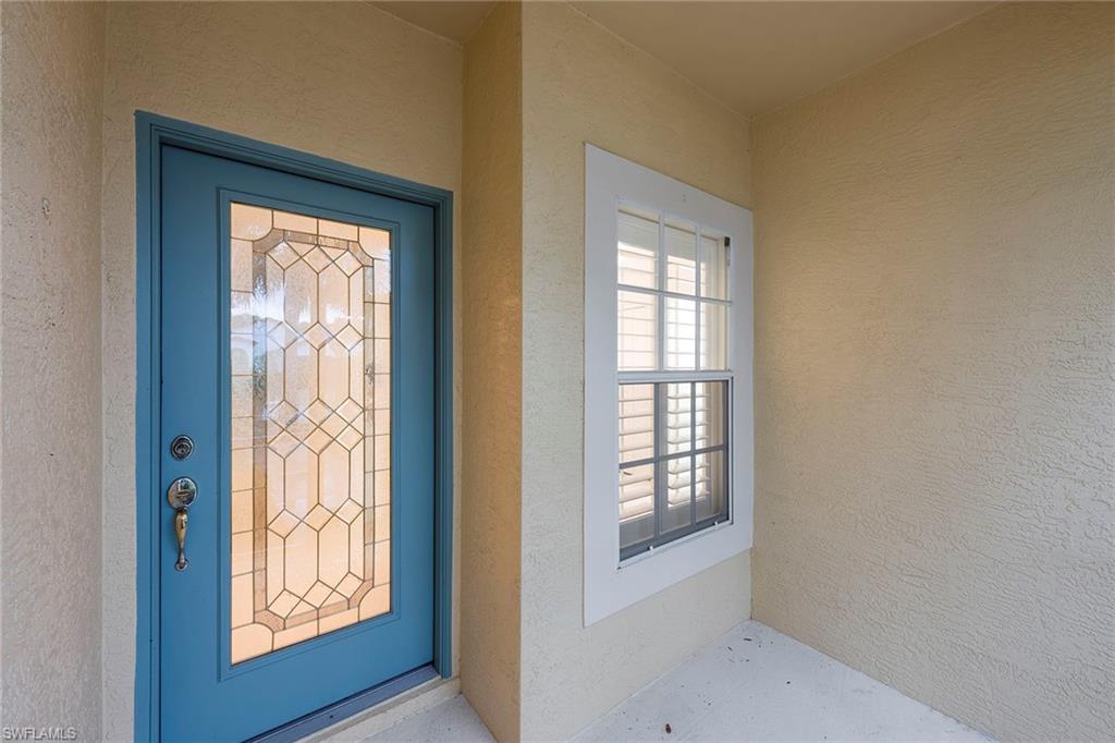 21695 Brixham Run Loop Estero, FL 33928 - Photo 4 of 32 a view of an front door