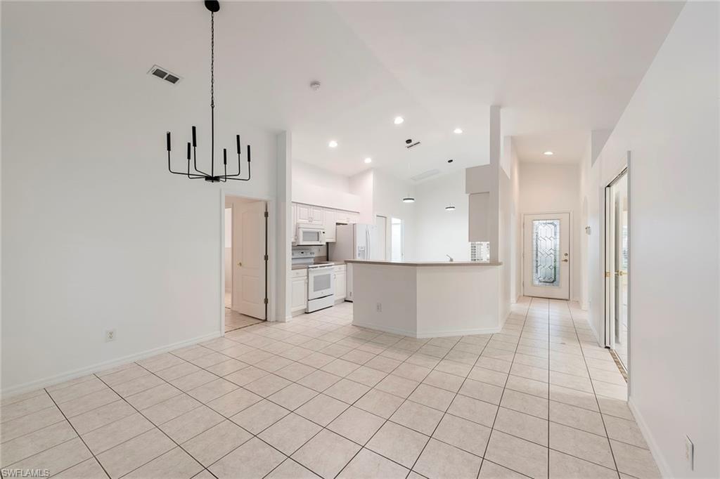 21695 Brixham Run Loop Estero, FL 33928 - Photo 7 of 32 a view of a kitchen and kitchen island