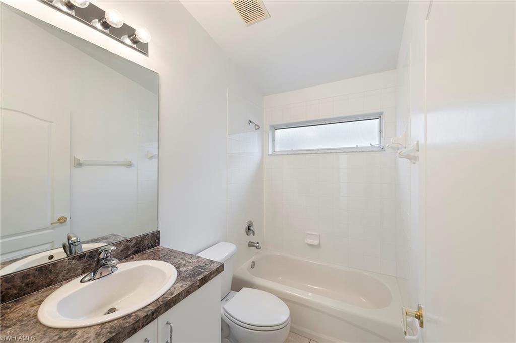 21695 Brixham Run Loop Estero, FL 33928 - Photo 8 of 32 a bathroom with a sink toilet and shower