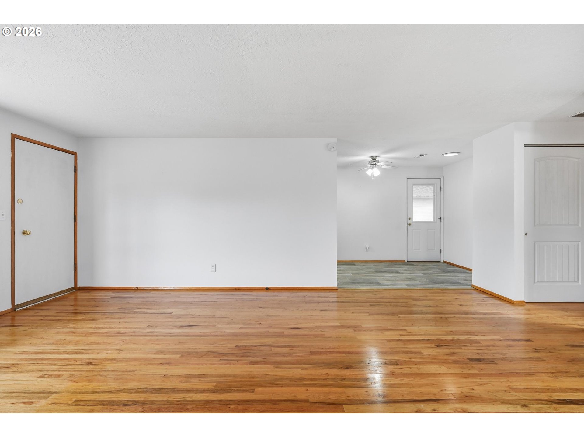 1720 Jansen Way Woodburn, OR 97071 - Photo 7 of 41 a view of an empty room and wooden floor