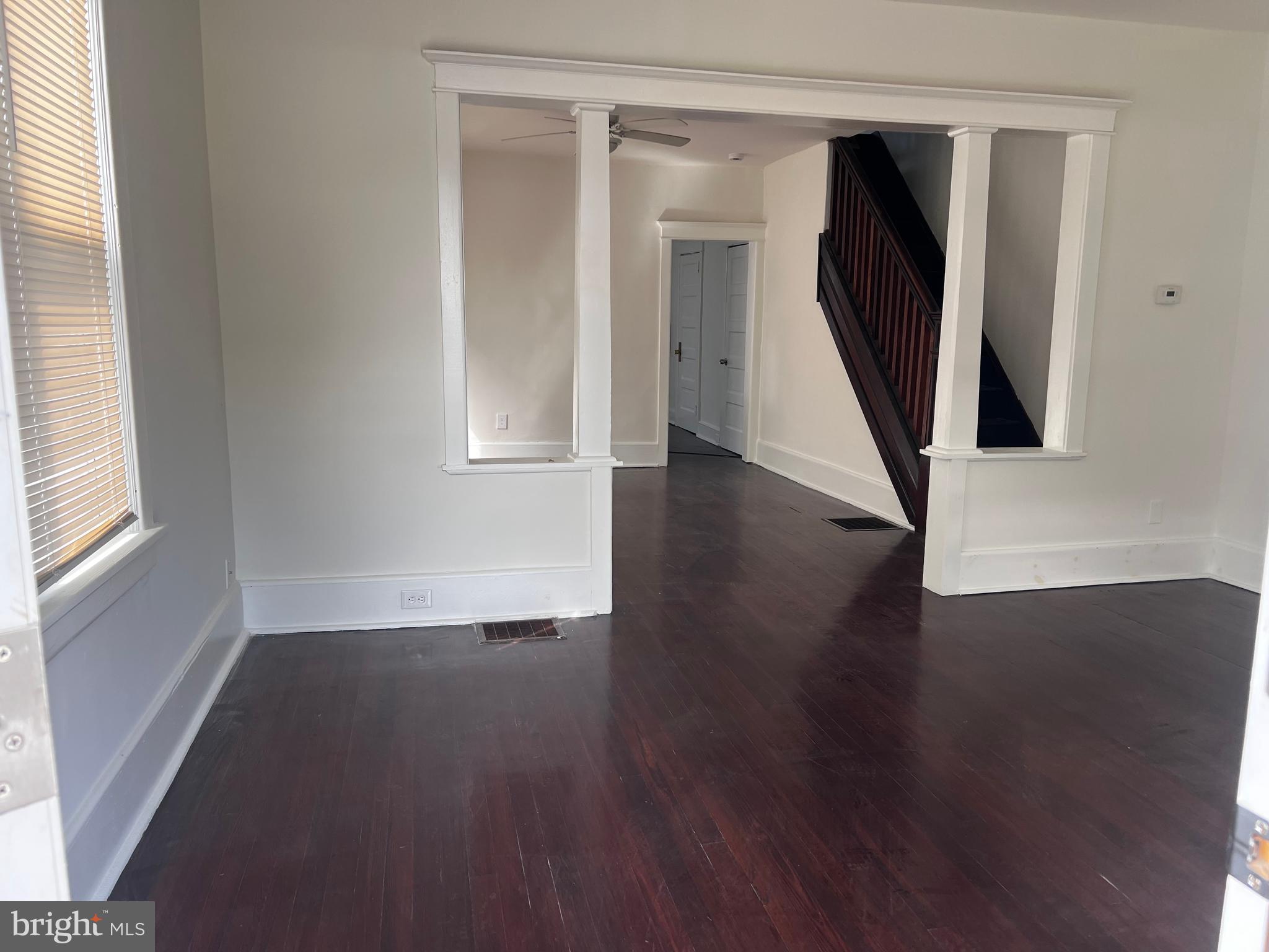 529 Bridgeboro Street Riverside, NJ 08075 - Photo 2 of 7 a view of a hallway with wooden floor and stairs