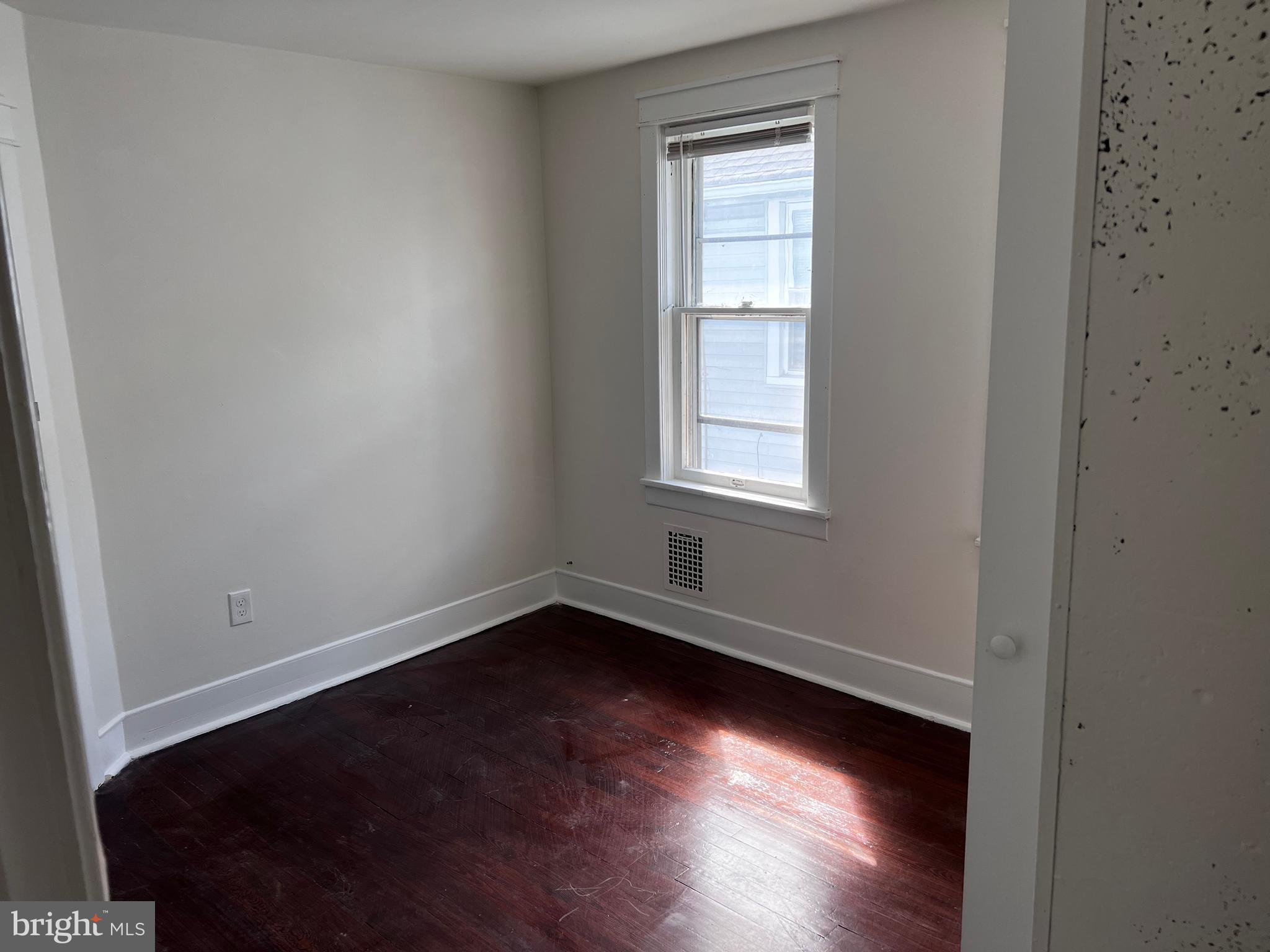 529 Bridgeboro Street Riverside, NJ 08075 - Photo 7 of 7 an empty room with wooden floor and windows