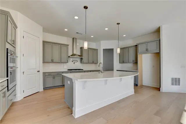 a view of an empty room with a ceiling fan