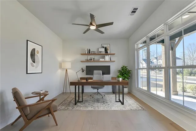 a view of a dining room with furniture window and outside view
