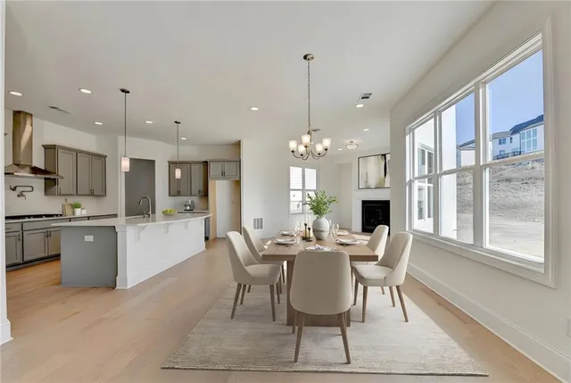 a view of an empty room with a fireplace and a window