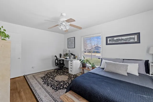 a bathroom with a toilet a sink and a mirror