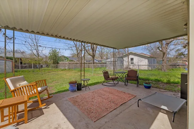 a bedroom with a bed cabinets and a window