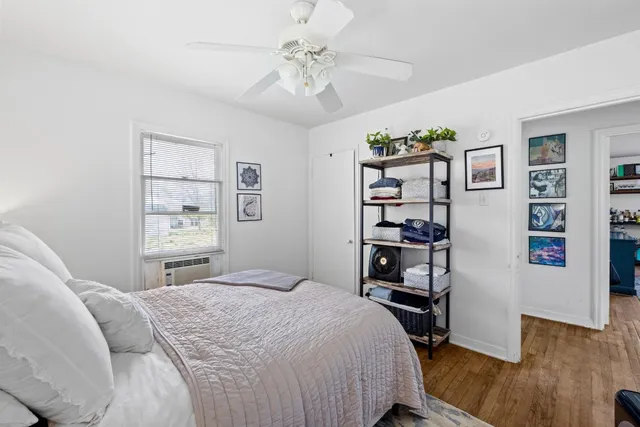 a bedroom with bed and a window