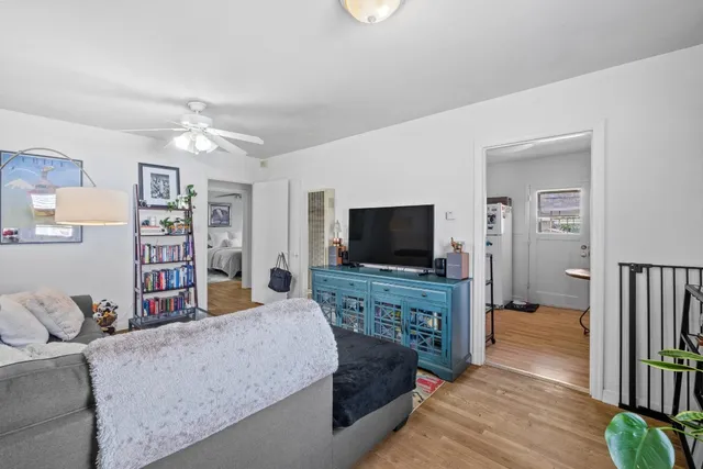 a bedroom with furniture and a flat screen tv
