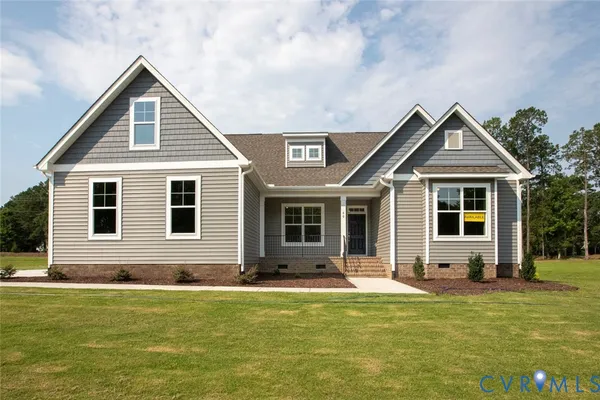 a front view of house with yard outdoor seating and barbeque oven