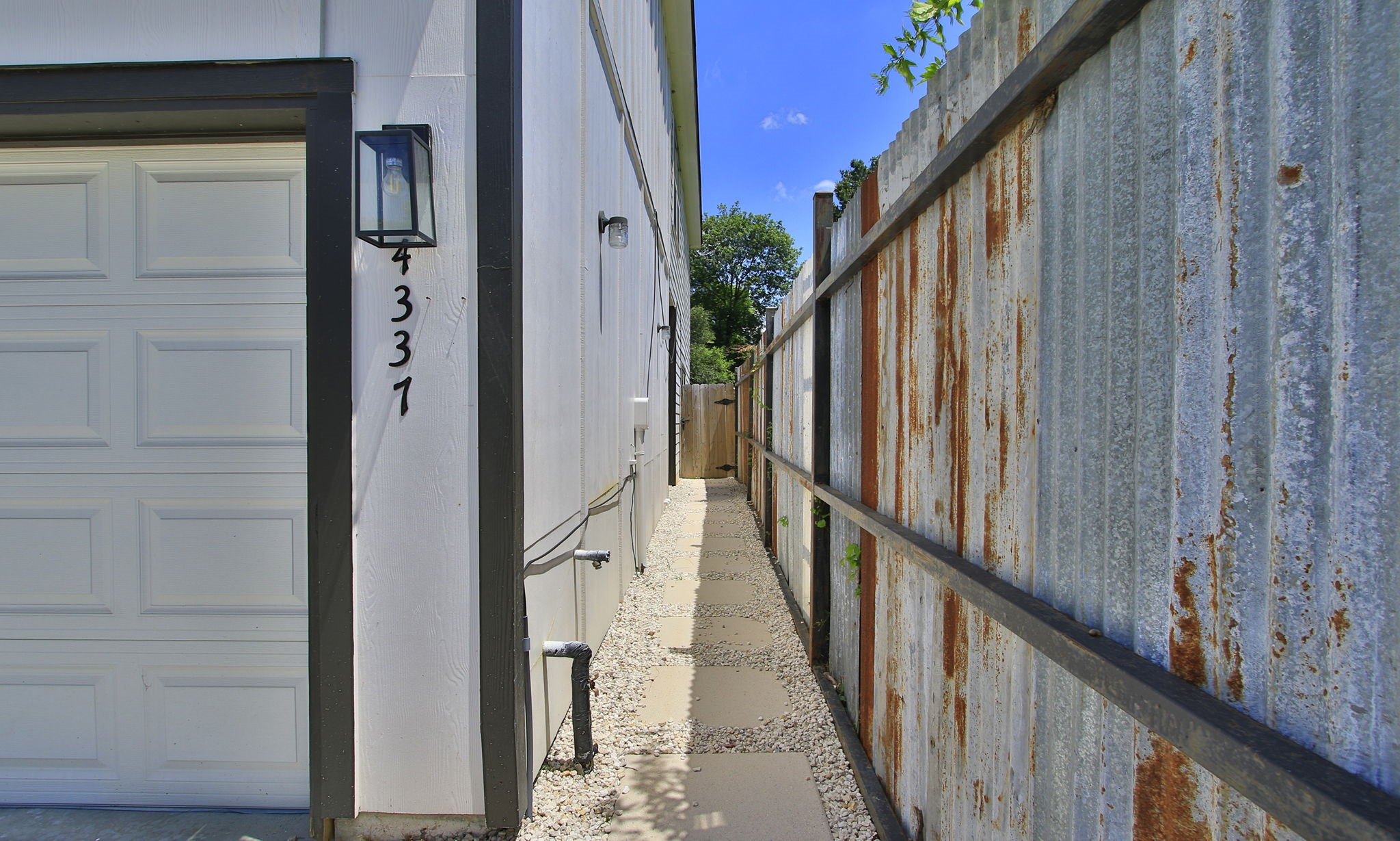 4337 Faulkner Street Houston, TX 77021 - Photo 36 of 39 a view of a balcony with wooden floor and staircase