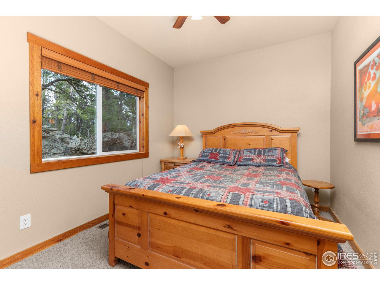 308 Pinon Circle Black Hawk, CO 80422 - Photo 14 of 37 a bedroom with a bed and a window