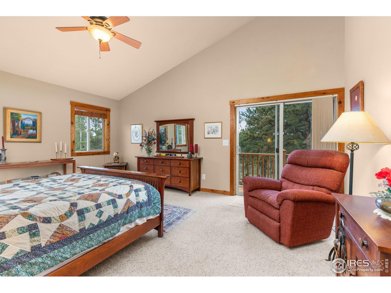 308 Pinon Circle Black Hawk, CO 80422 - Photo 16 of 37 a bedroom with bed couch and window
