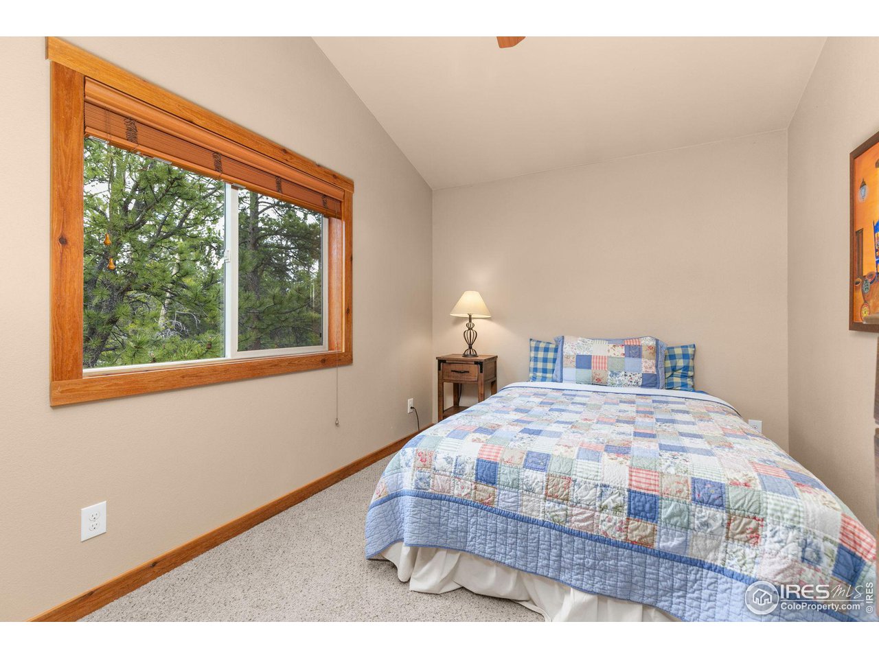 308 Pinon Circle Black Hawk, CO 80422 - Photo 20 of 37 a bedroom with a bed window and a table