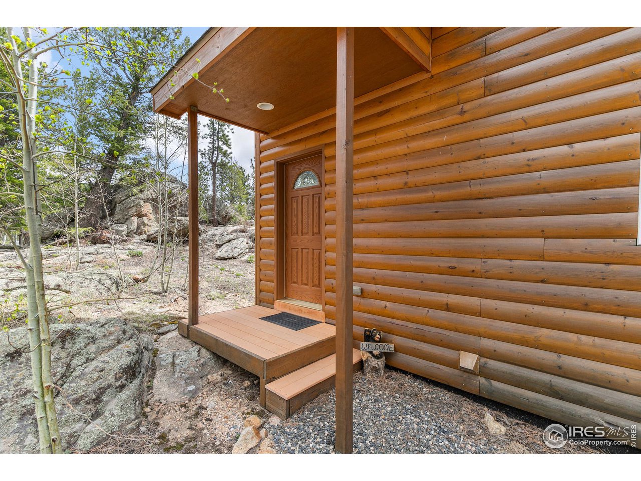 308 Pinon Circle Black Hawk, CO 80422 - Photo 5 of 37 a backyard of a house with a table and chairs