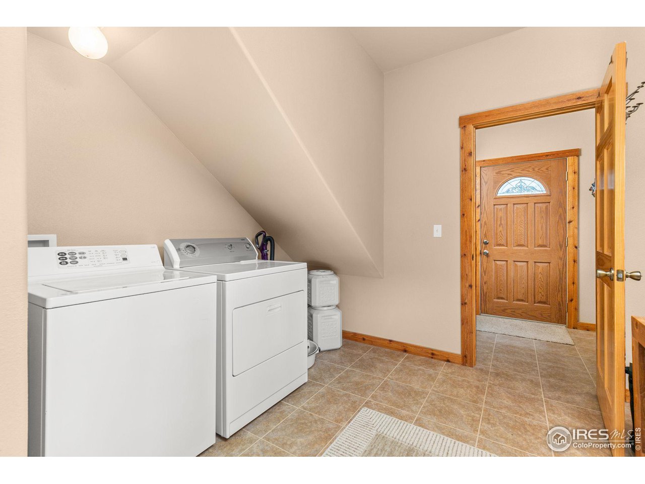 308 Pinon Circle Black Hawk, CO 80422 - Photo 7 of 37 a utility room with dryer and washer