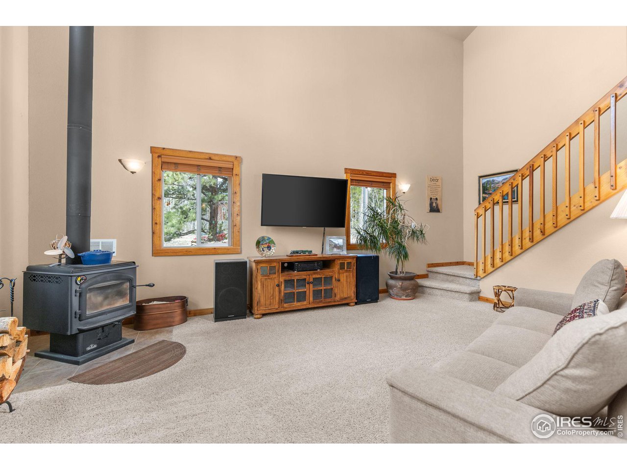 308 Pinon Circle Black Hawk, CO 80422 - Photo 8 of 37 a living room with furniture and a flat screen tv
