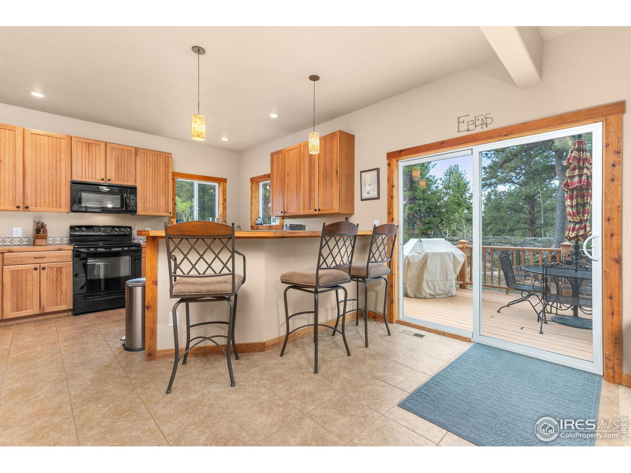 308 Pinon Circle Black Hawk, CO 80422 - Photo 9 of 37 a living room with stainless steel appliances granite countertop furniture and a wooden floor