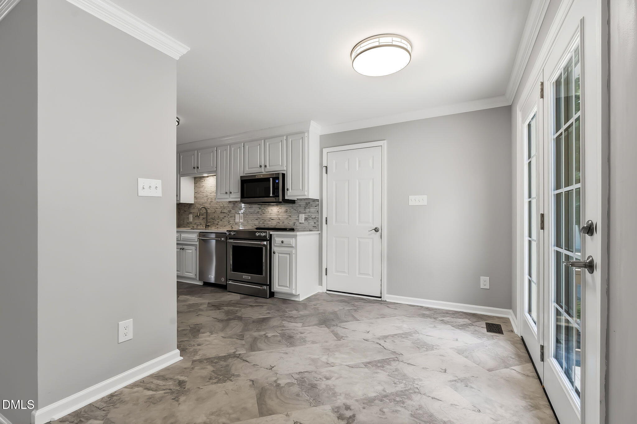 1112 Tyler Farms Drive Raleigh, NC 27603 - Photo 26 of 78 a view of a kitchen with a sink and dishwasher a refrigerator with wooden floor