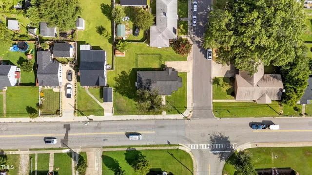 front view of multiple houses with a yard