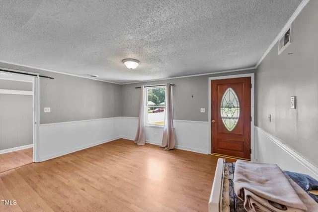 a view of an empty room and window
