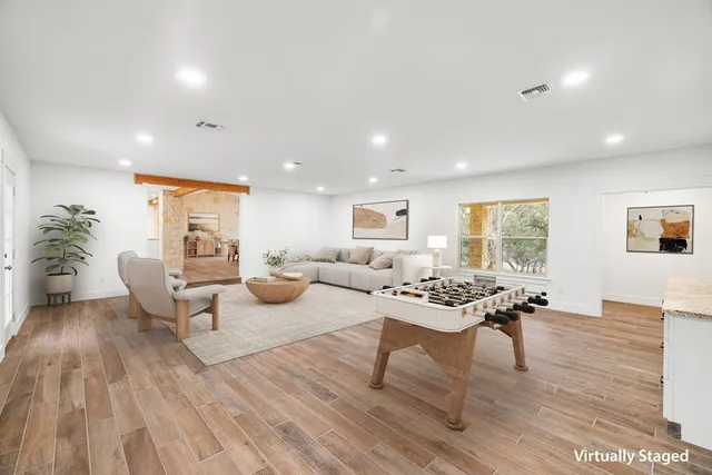 a view of a dining room with furniture and wooden floor