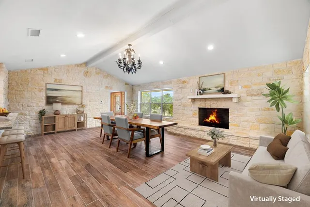 a view of a kitchen with wooden floor and stairs