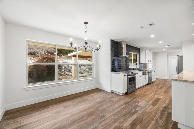 a view of a dining room with furniture window and wooden floor