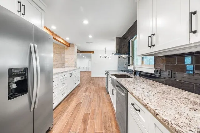 a bathroom with a bathtub and shower