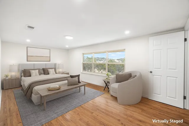 a bathroom with a sink double vanity granite and a mirror