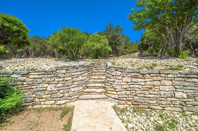 a view of a patio with two chairs and a table
