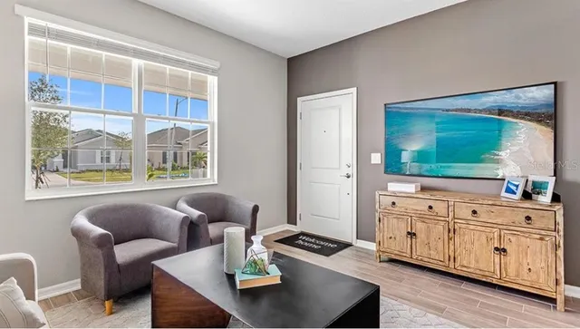 a living room with furniture and window