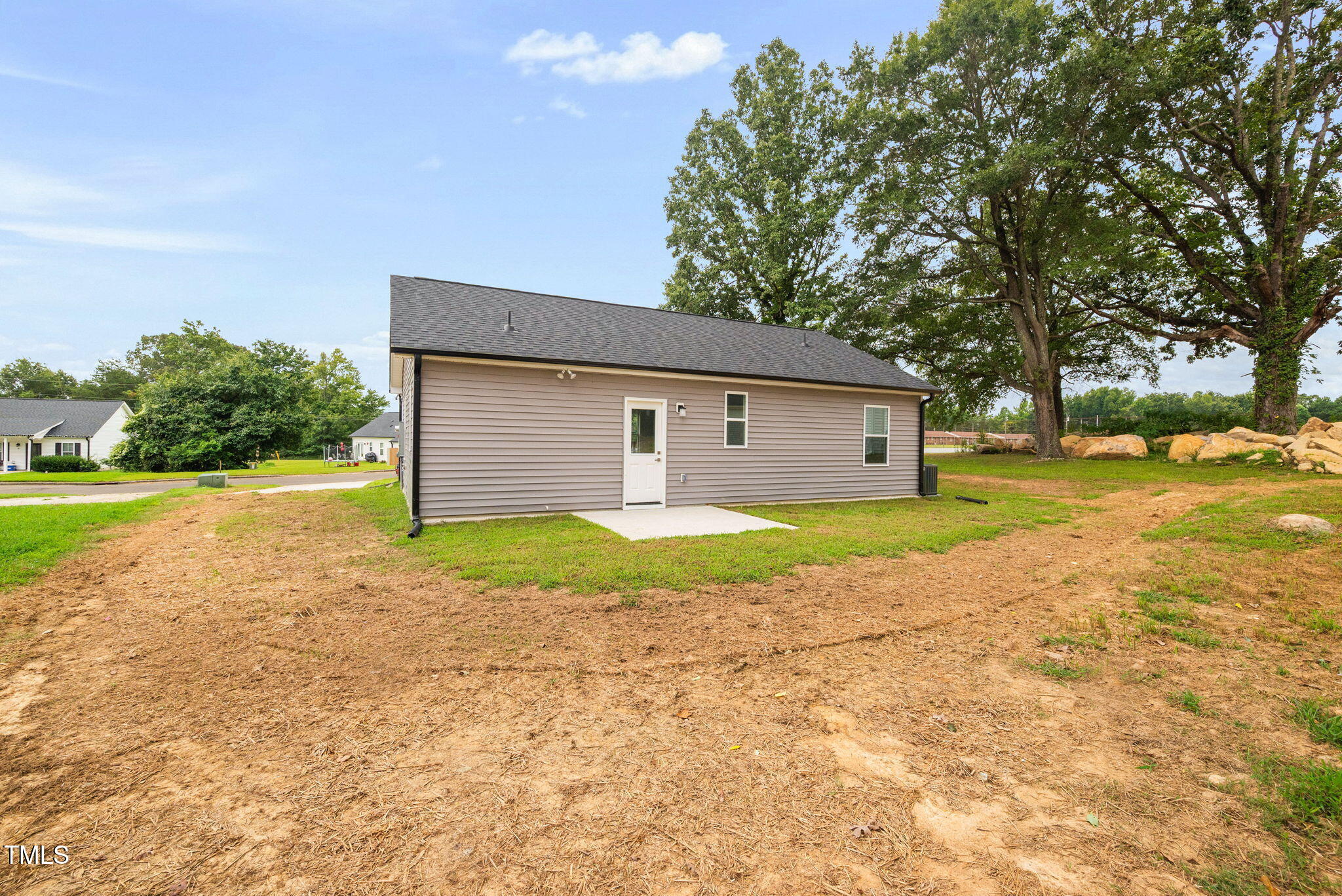 19 Southern Village Drive Roxboro, NC 27573 - Photo 24 of 31 a front view of house with yard and trees around