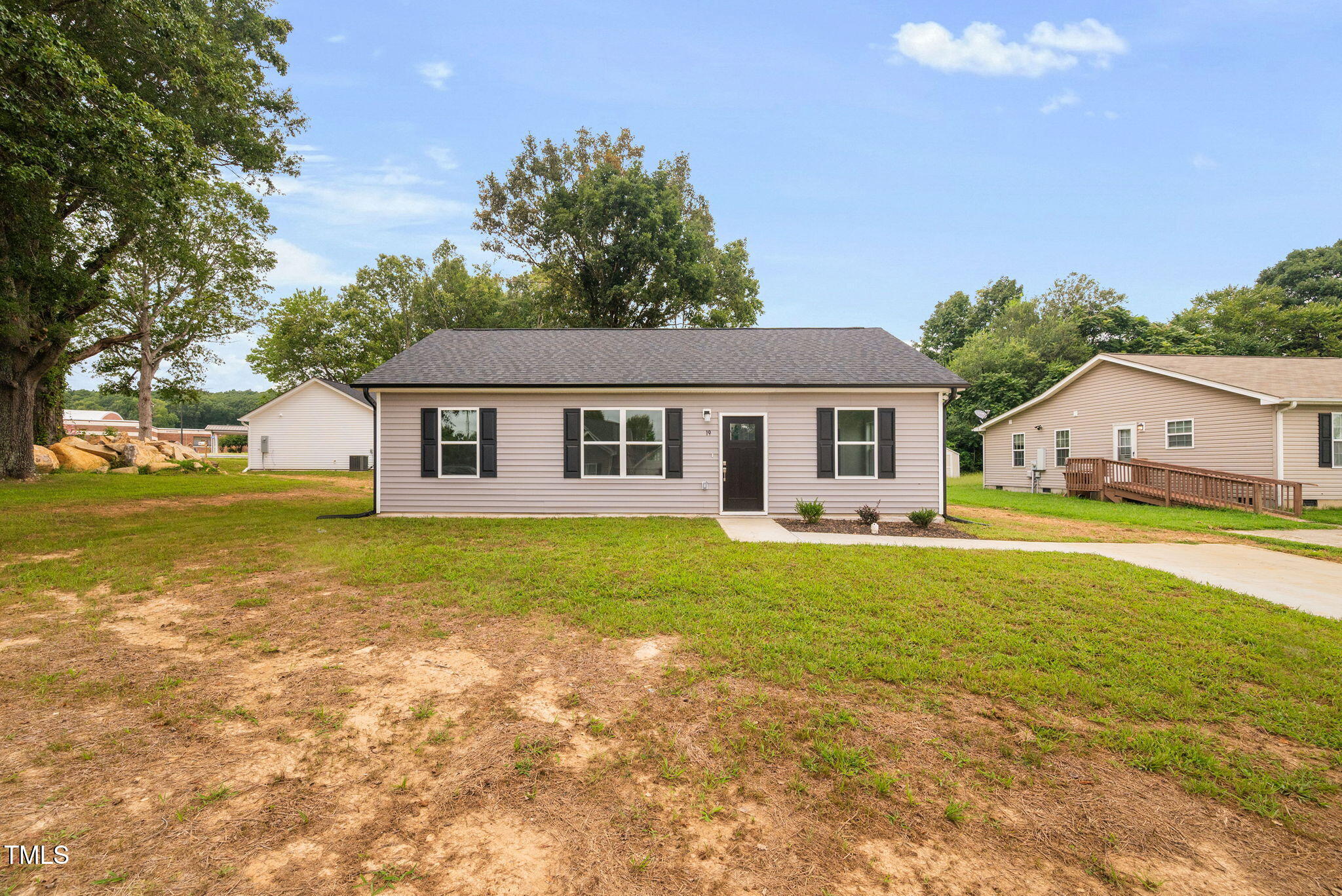 19 Southern Village Drive Roxboro, NC 27573 - Photo 2 of 31 a front view of a house with swimming pool having outdoor seating