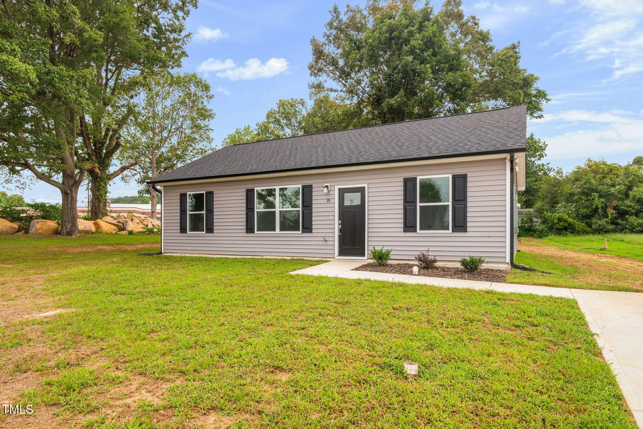 19 Southern Village Drive Roxboro, NC 27573 - Photo 4 of 31 a house view with swimming pool and garden