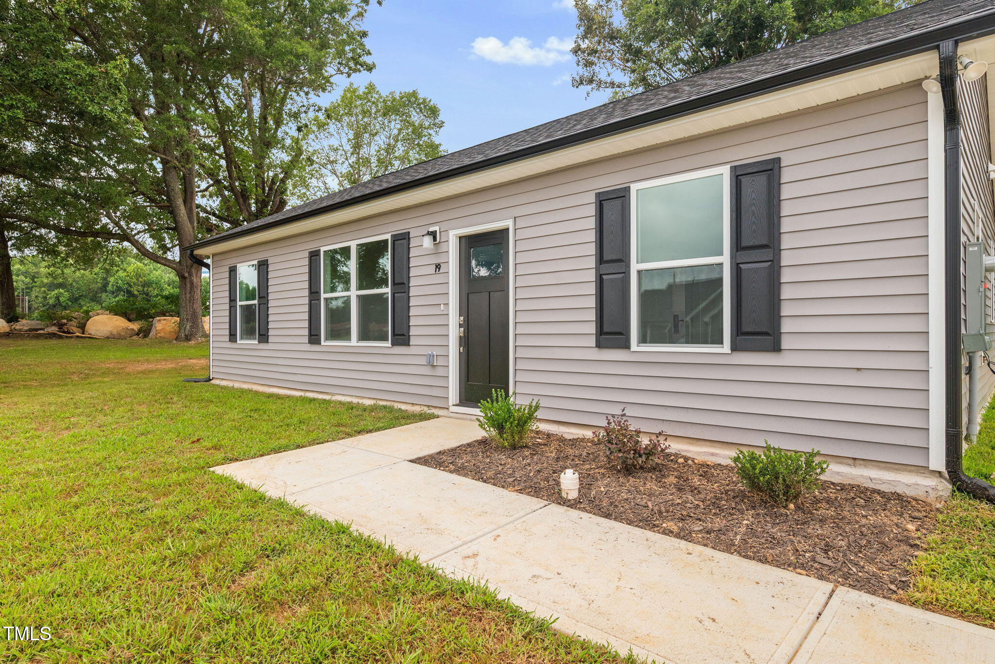 19 Southern Village Drive Roxboro, NC 27573 - Photo 5 of 31 a front view of a house with garden