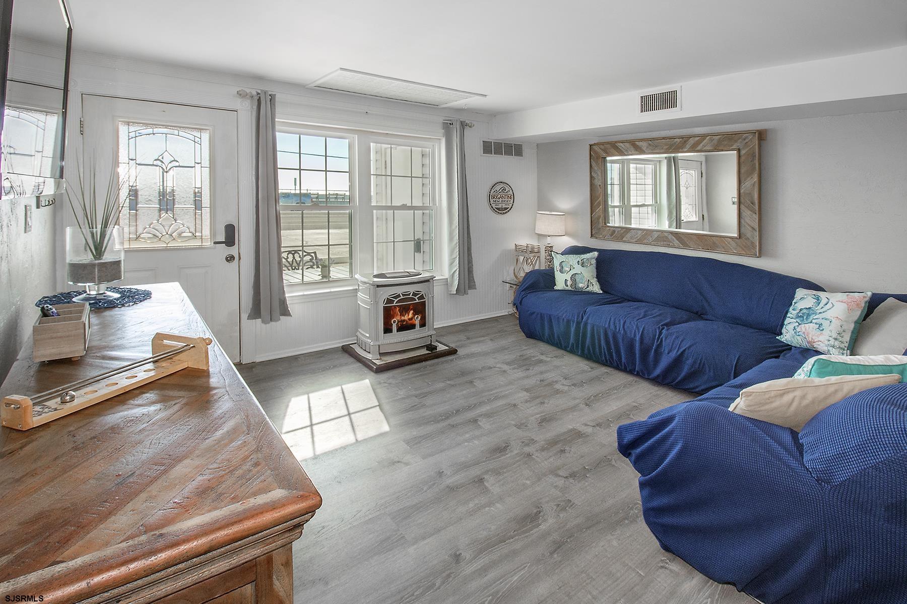 1101 East Brigantine Avenue, Unit 2 Brigantine, NJ 08203 - Photo 12 of 13 a living room with furniture and a window