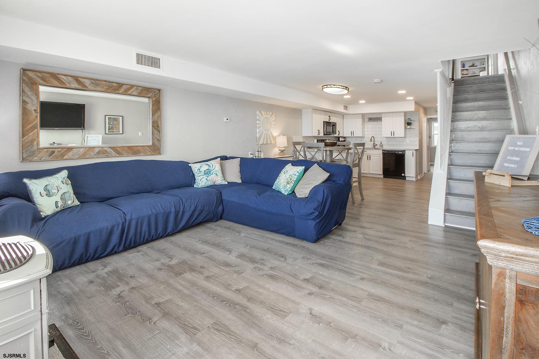 1101 East Brigantine Avenue, Unit 2 Brigantine, NJ 08203 - Photo 2 of 13 a view of living room kitchen with furniture and wooden floor