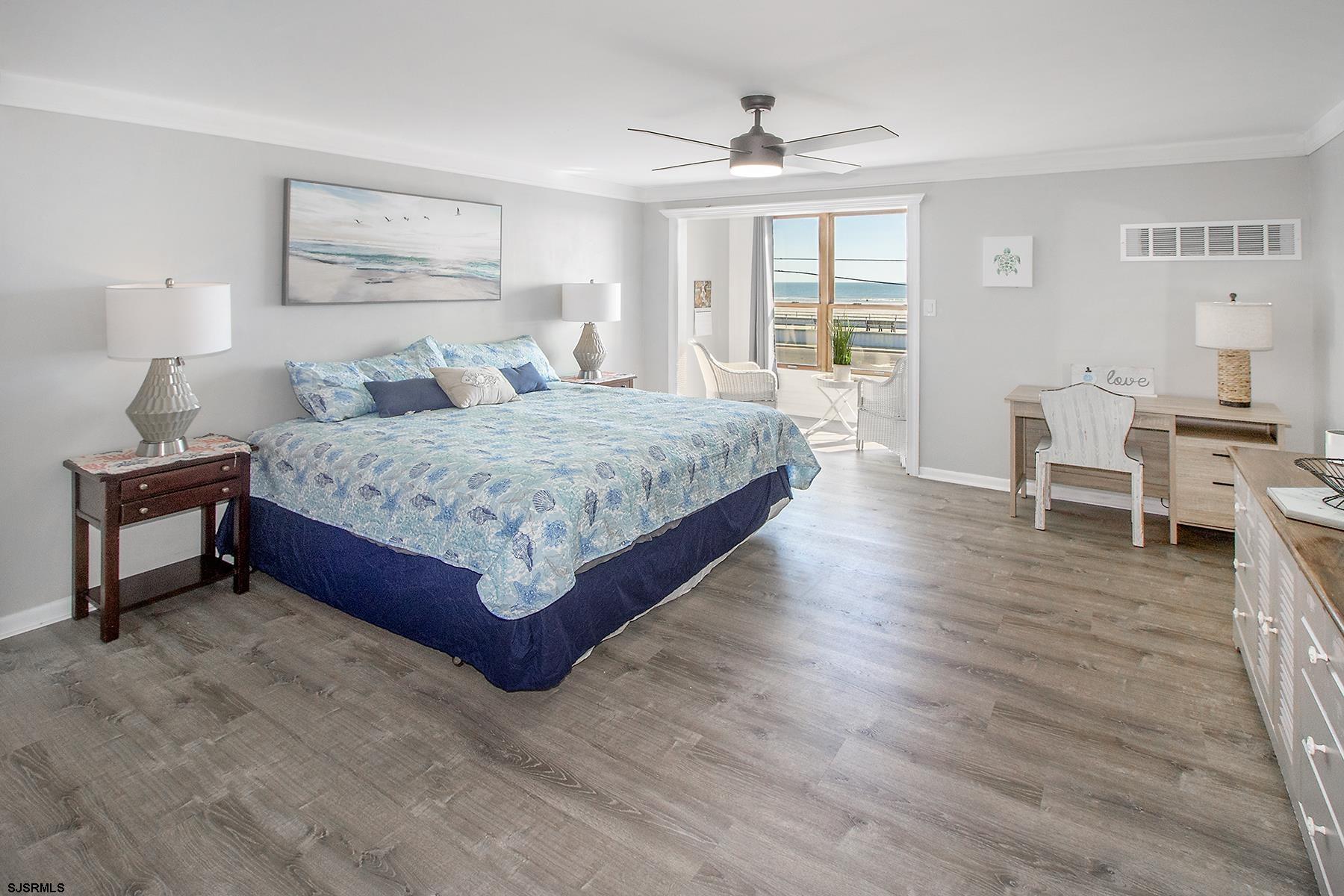 1101 East Brigantine Avenue, Unit 2 Brigantine, NJ 08203 - Photo 10 of 13 a spacious bedroom with a large bed and a wooden floor