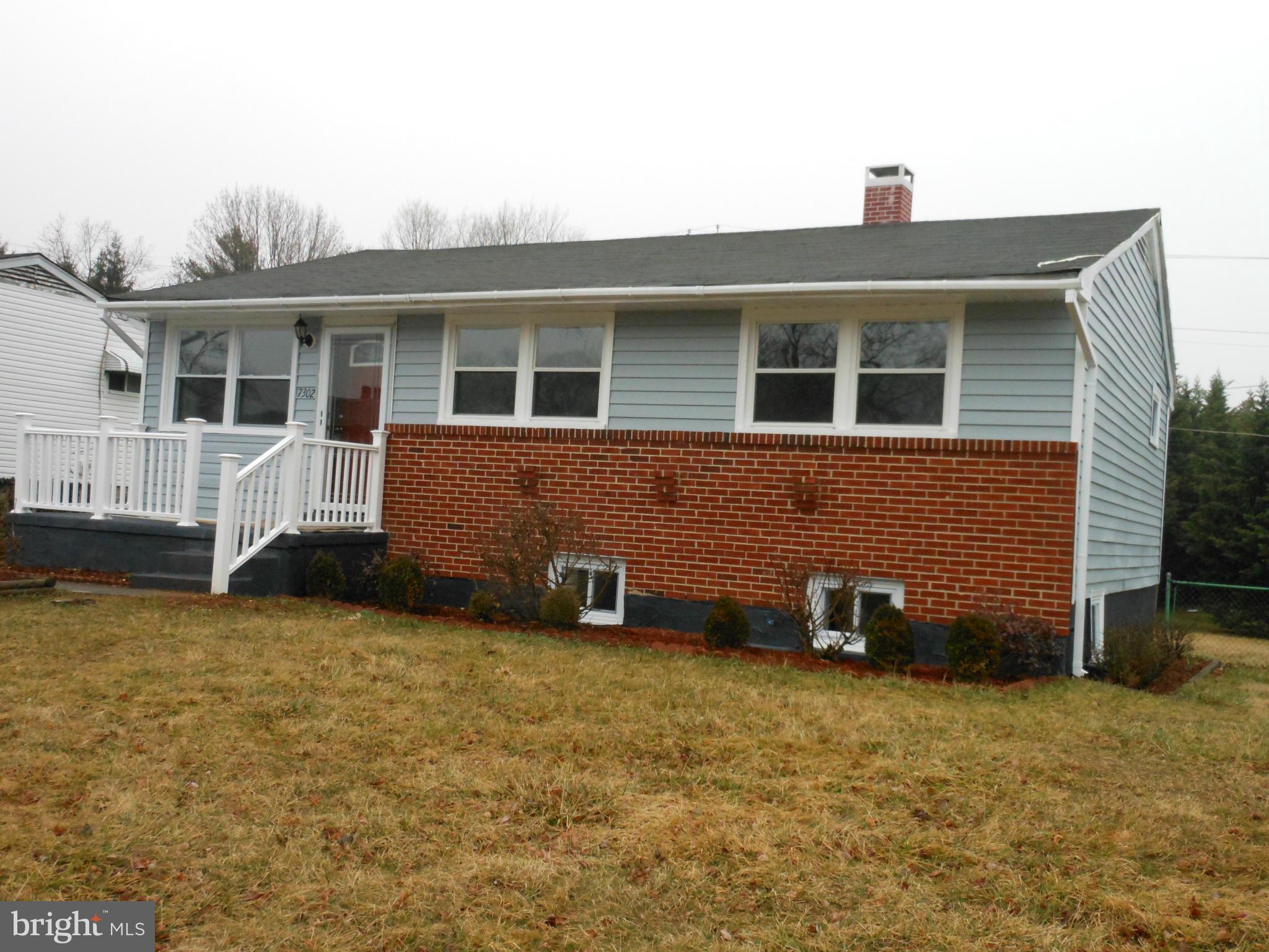 7302 Dooman Road Baltimore, MD 21244 - Photo 1 of 29 a front view of a house with a yard