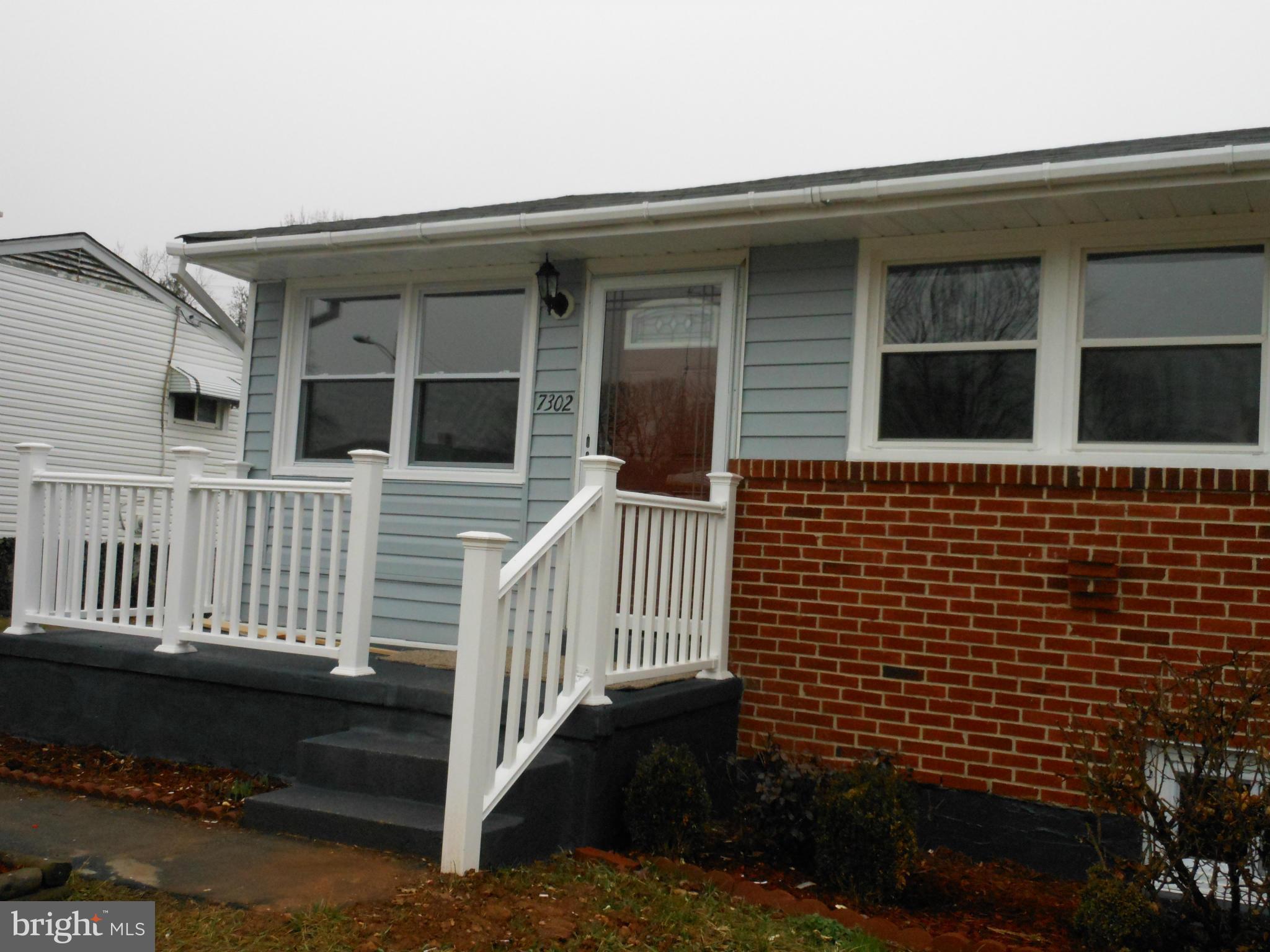 7302 Dooman Road Baltimore, MD 21244 - Photo 2 of 29 a view of a house with a yard