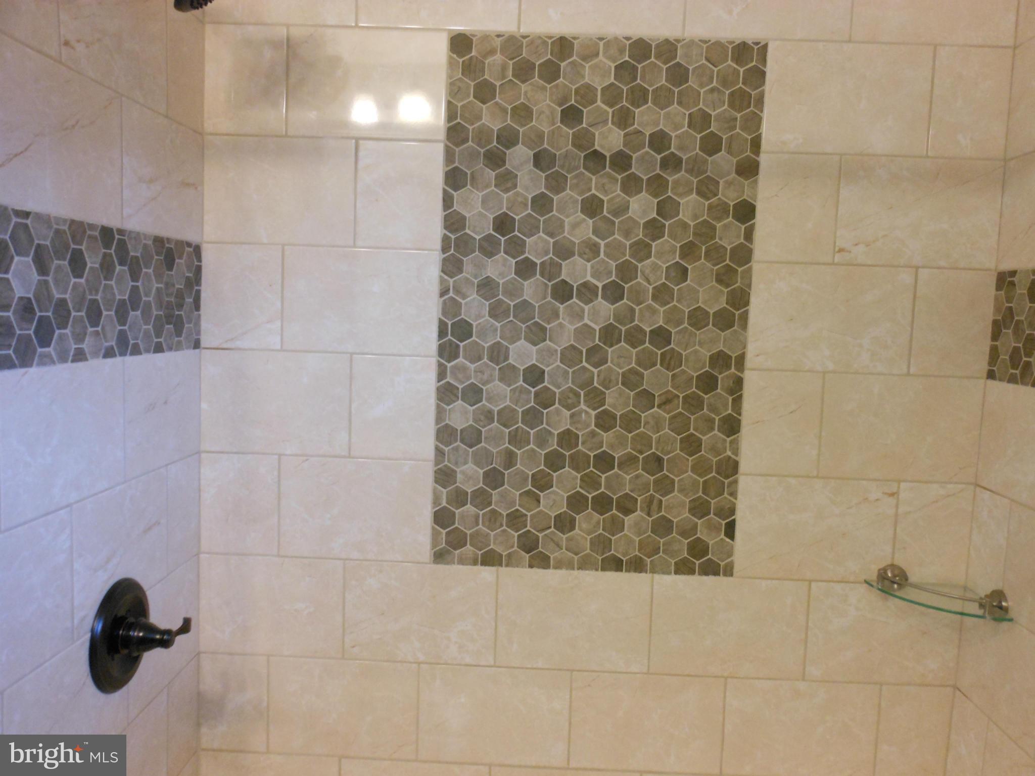 7302 Dooman Road Baltimore, MD 21244 - Photo 13 of 29 a bathroom with a shower
