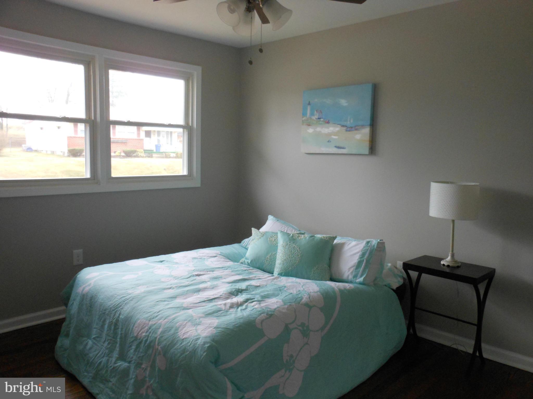7302 Dooman Road Baltimore, MD 21244 - Photo 17 of 29 a bedroom with a bed and a window