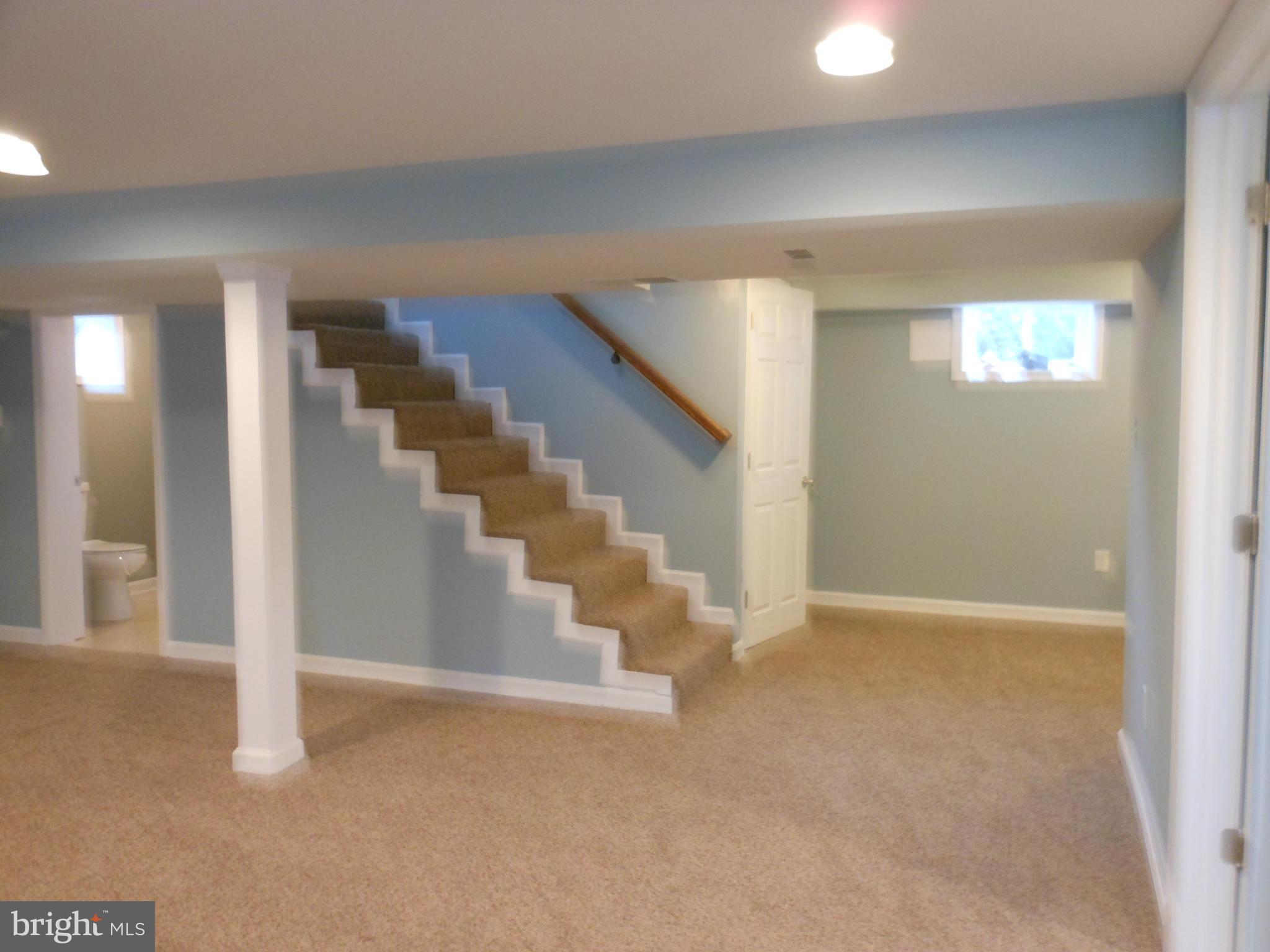 7302 Dooman Road Baltimore, MD 21244 - Photo 20 of 29 a view of an empty room with stairs